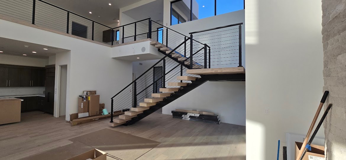 Modern floating staircase with horizontal cable railing system